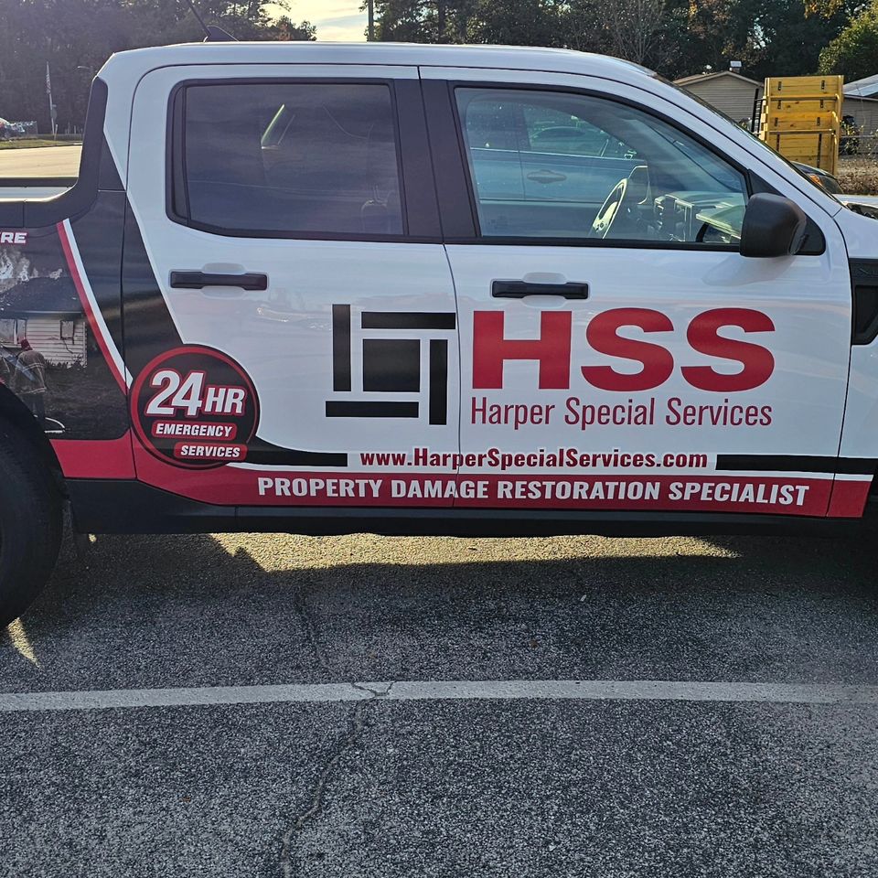 Harper Special Services commercial graphics on a white pickup